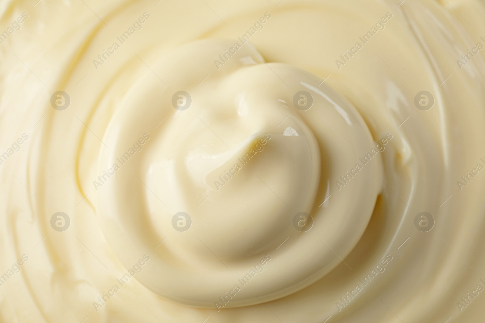 Photo of Fresh mayonnaise sauce as background, closeup. Top view