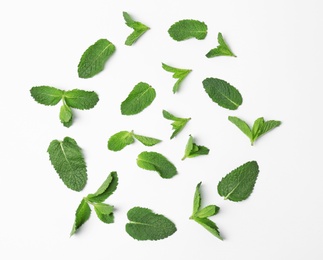 Flat lay composition with fresh green mint leaves on white background