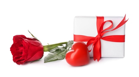 Photo of Beautiful gift box, rose and red heart on white background. Valentine's day celebration