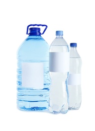 Different bottles of pure water with blank tags on white background