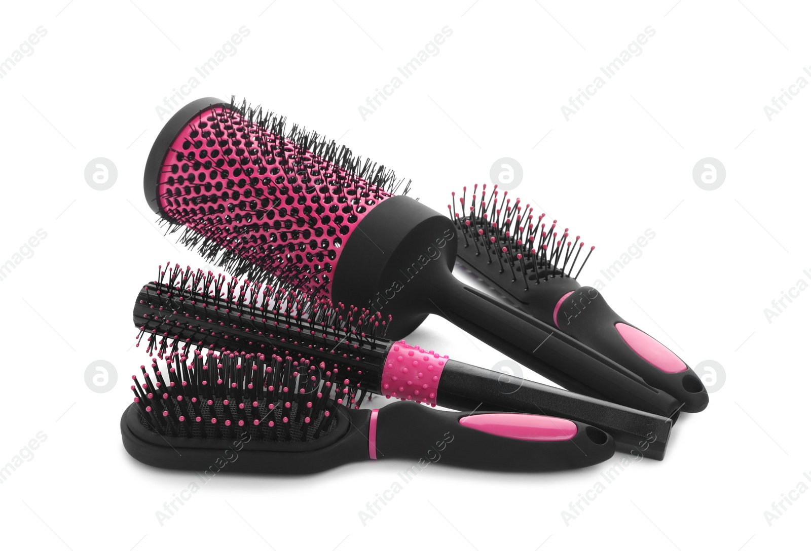 Photo of Set of modern hair brushes on white background