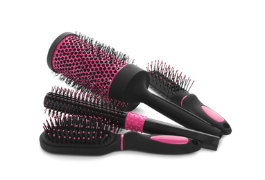 Photo of Set of modern hair brushes on white background