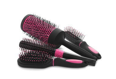 Set of modern hair brushes on white background