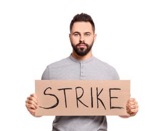 Photo of Young man holding cardboard banner with word Strike on white background