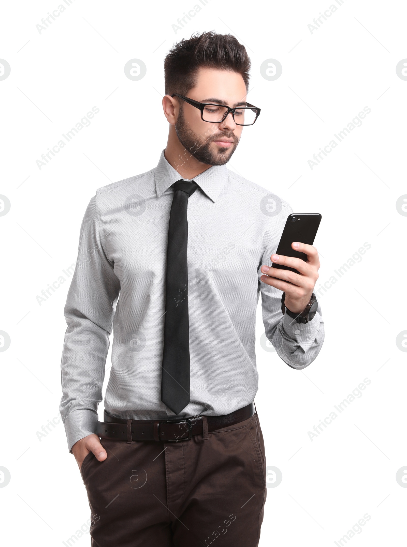 Photo of Young businessman with smartphone on white background