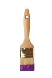 Photo of Brush with purple paint on white background