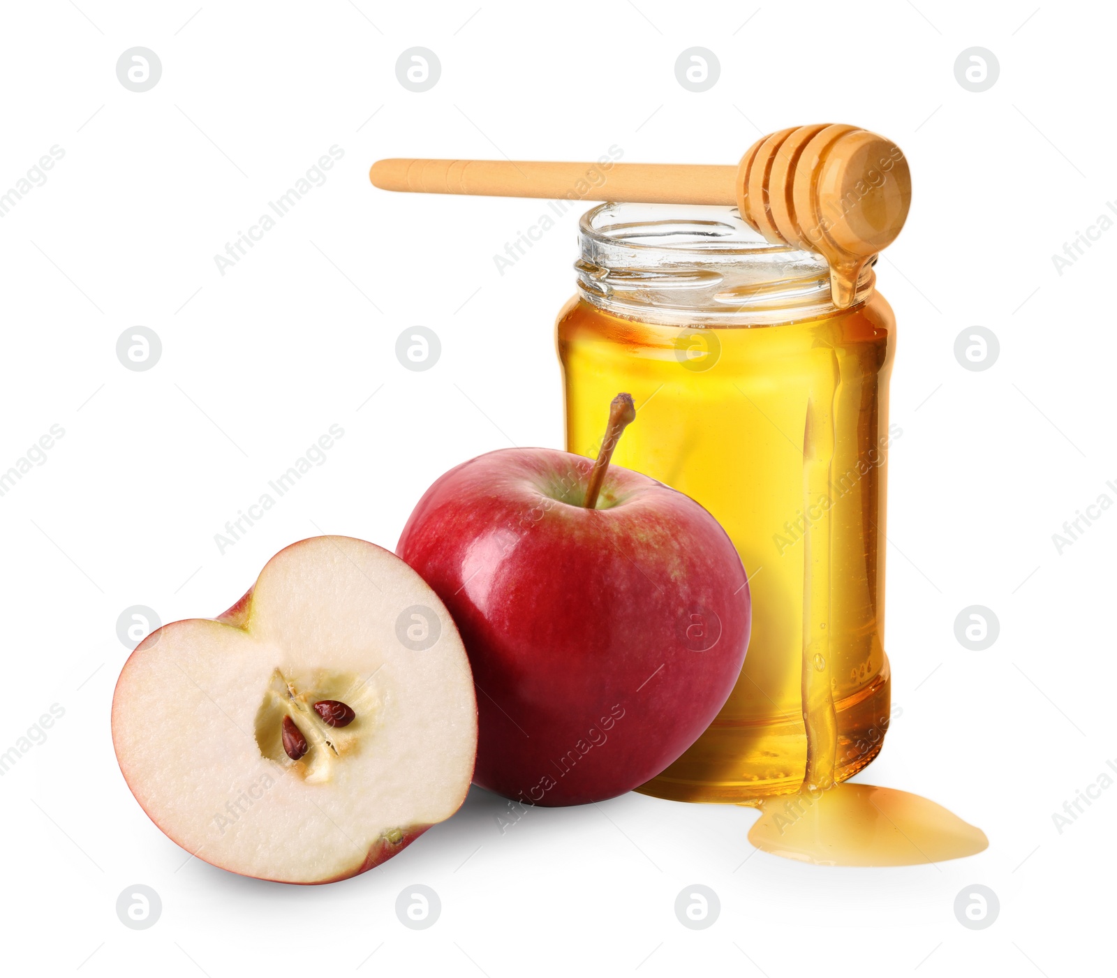 Image of Honey in glass jar, apples and dipper isolated on white