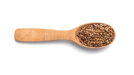 Photo of Wooden spoon with coriander on white background. Different spices