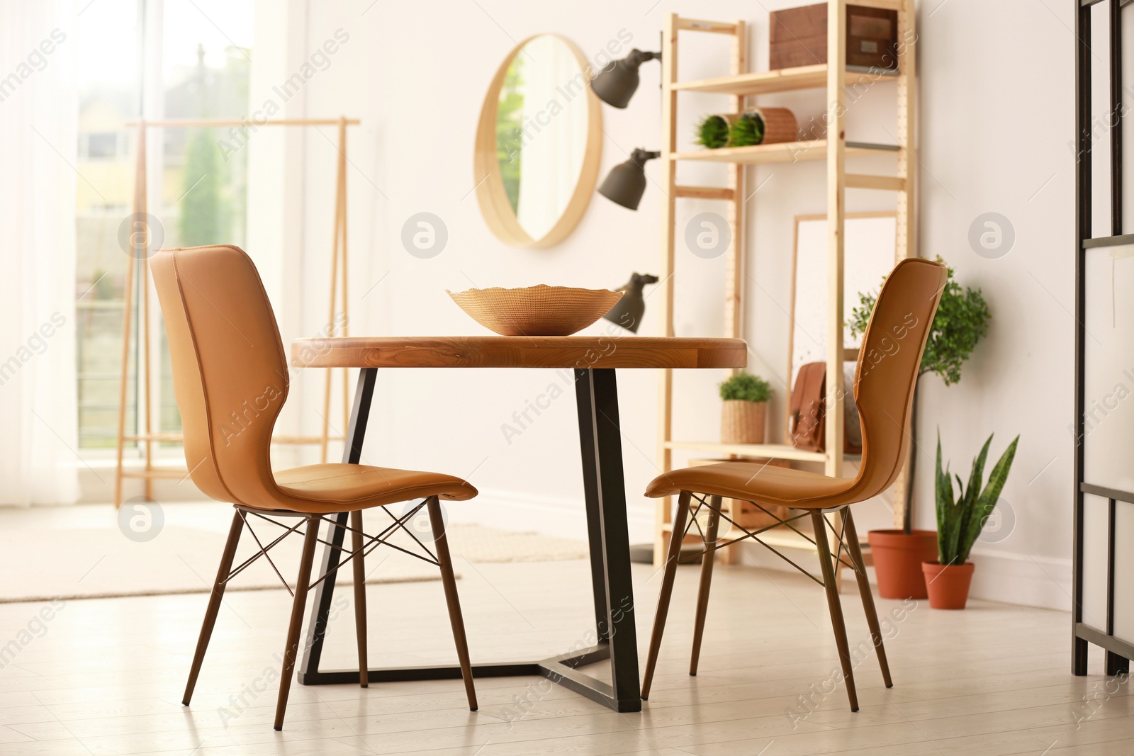 Photo of Modern dining room interior with table and chairs