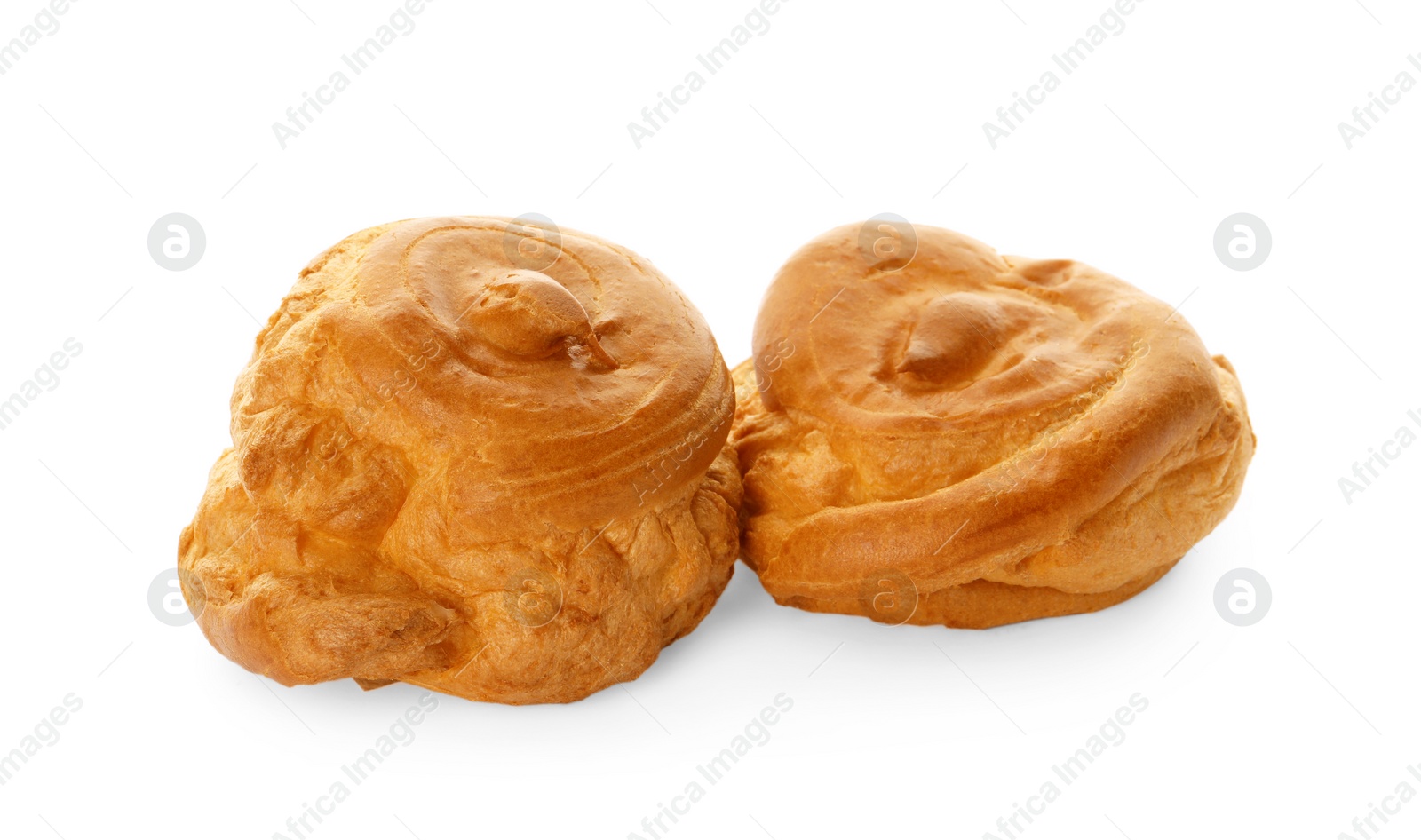 Photo of Two delicious fresh profiteroles on white background