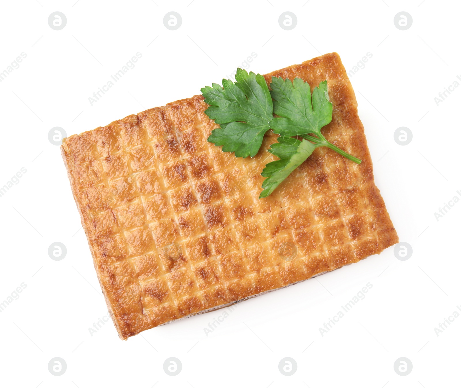 Photo of Block of delicious smoked tofu and parsley isolated on white, top view