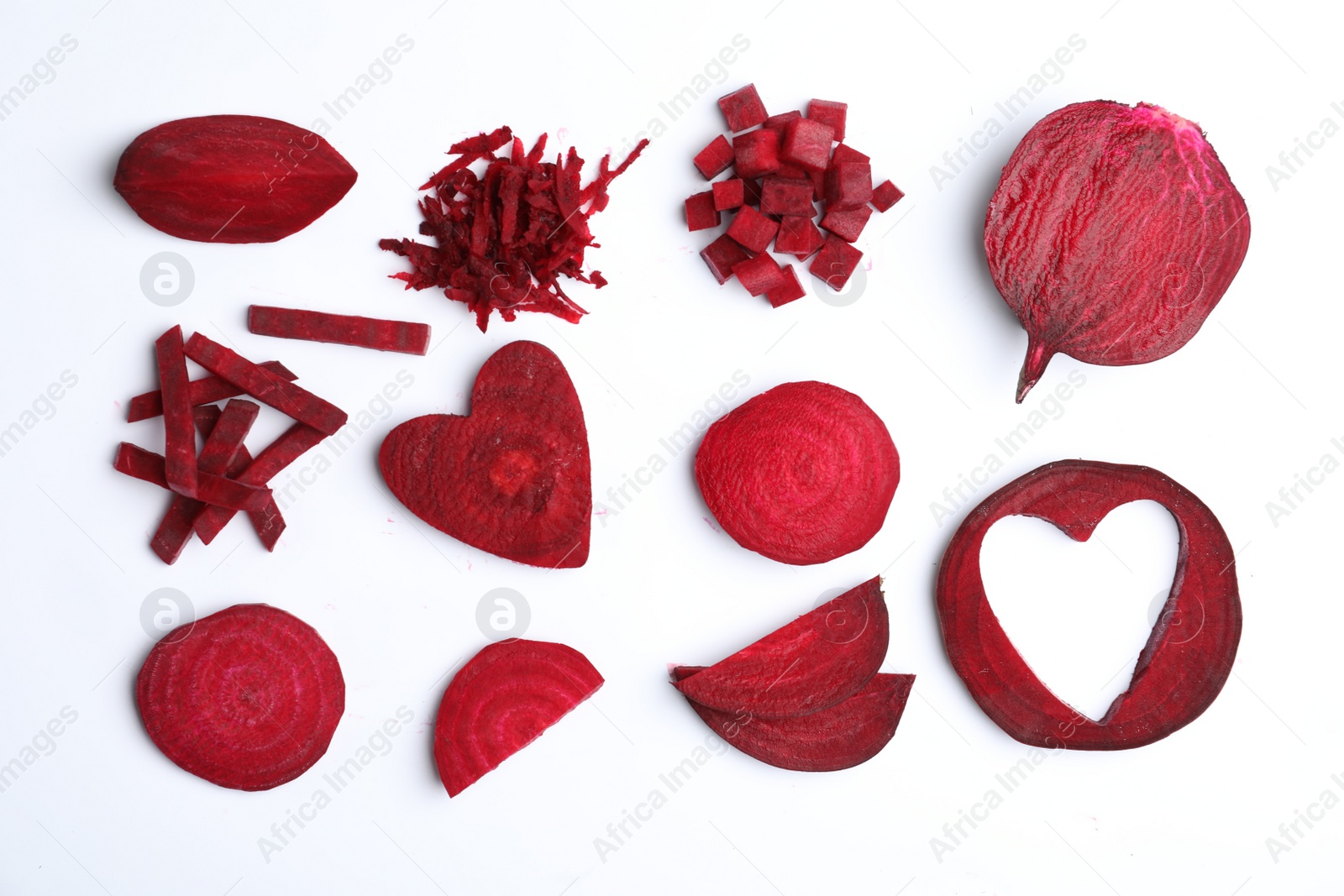 Photo of Composition with cut raw beets on white background, top view