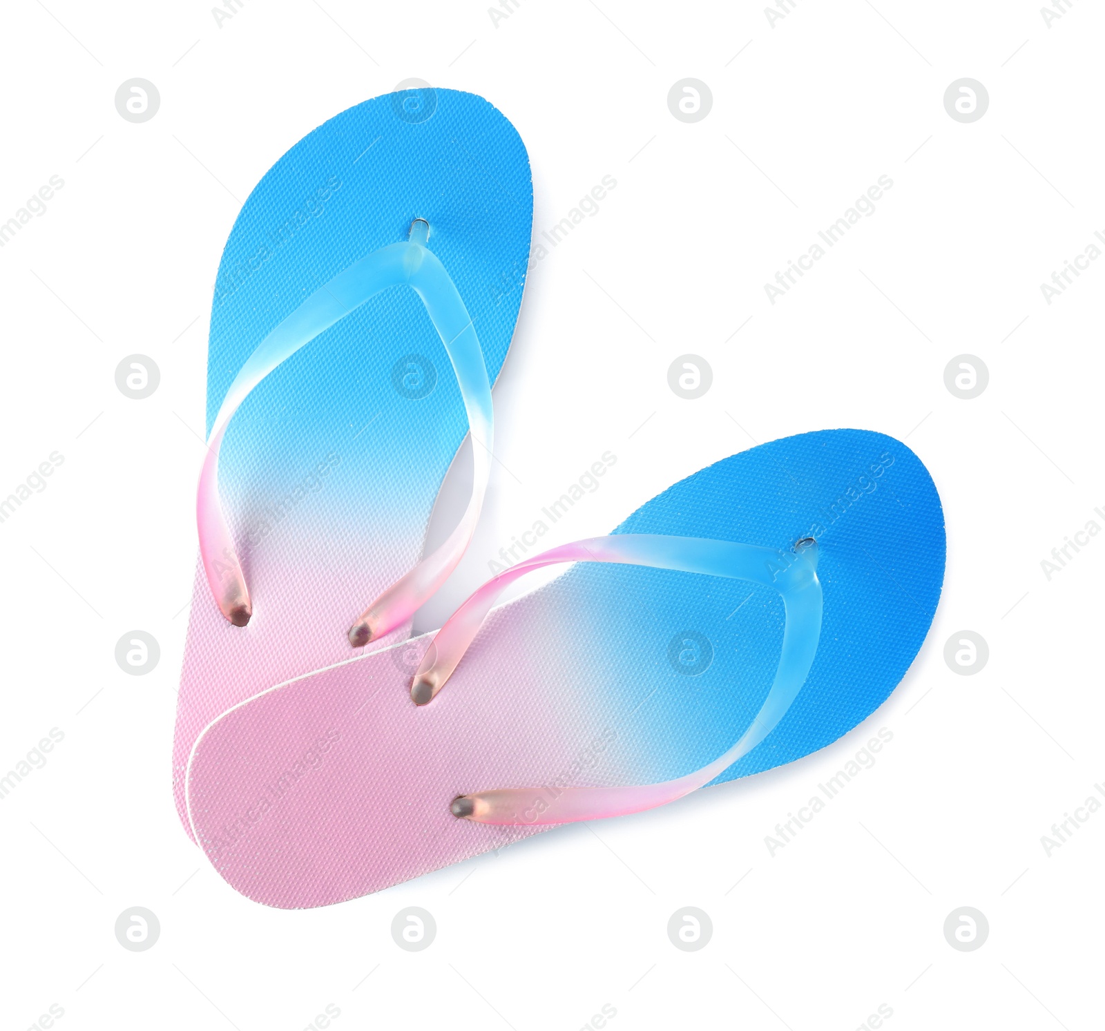 Photo of Bright flip flops on white background. Beach object