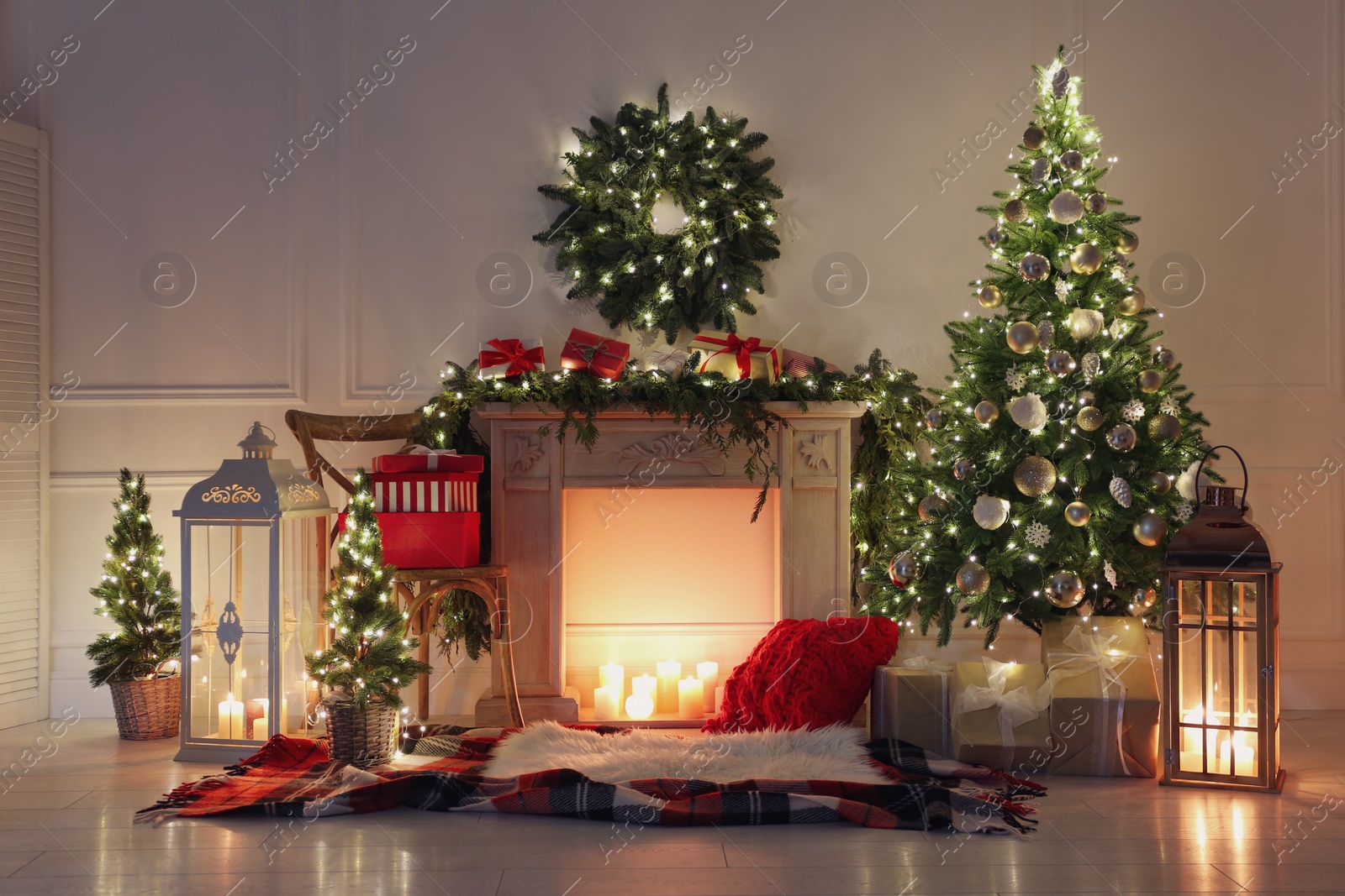 Photo of Beautiful Christmas themed photo zone with fireplace and fir decor