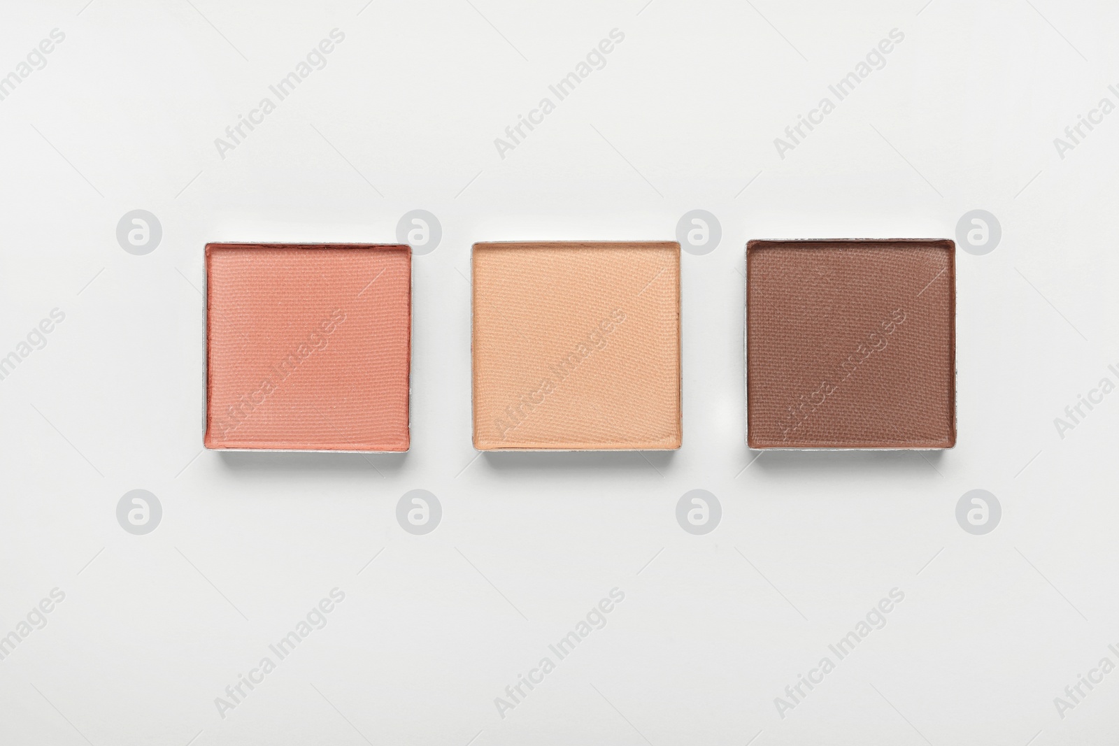 Photo of Different beautiful eye shadows on white background, flat lay