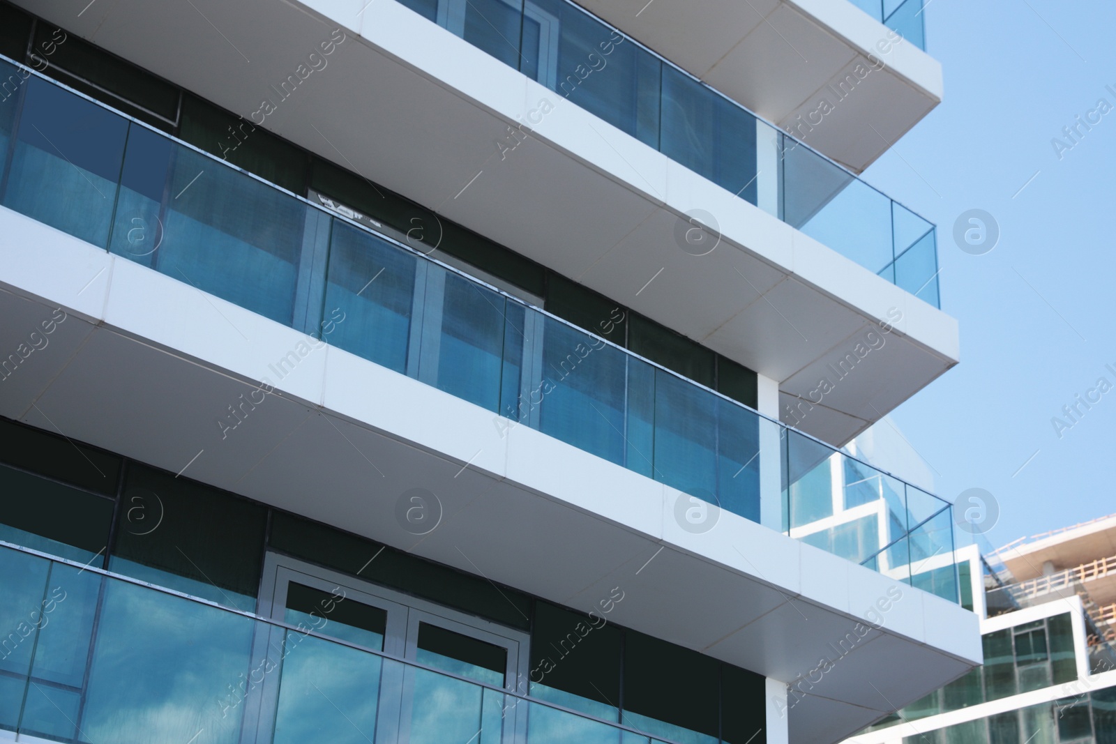 Photo of Exterior of residential building with balconies, low angle view