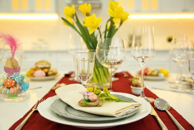 Festive Easter table setting with decorated eggs