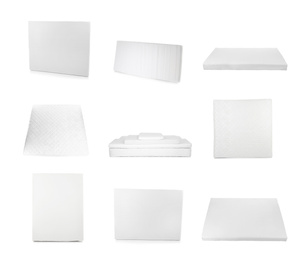 Image of Set with modern comfortable mattresses on white background 