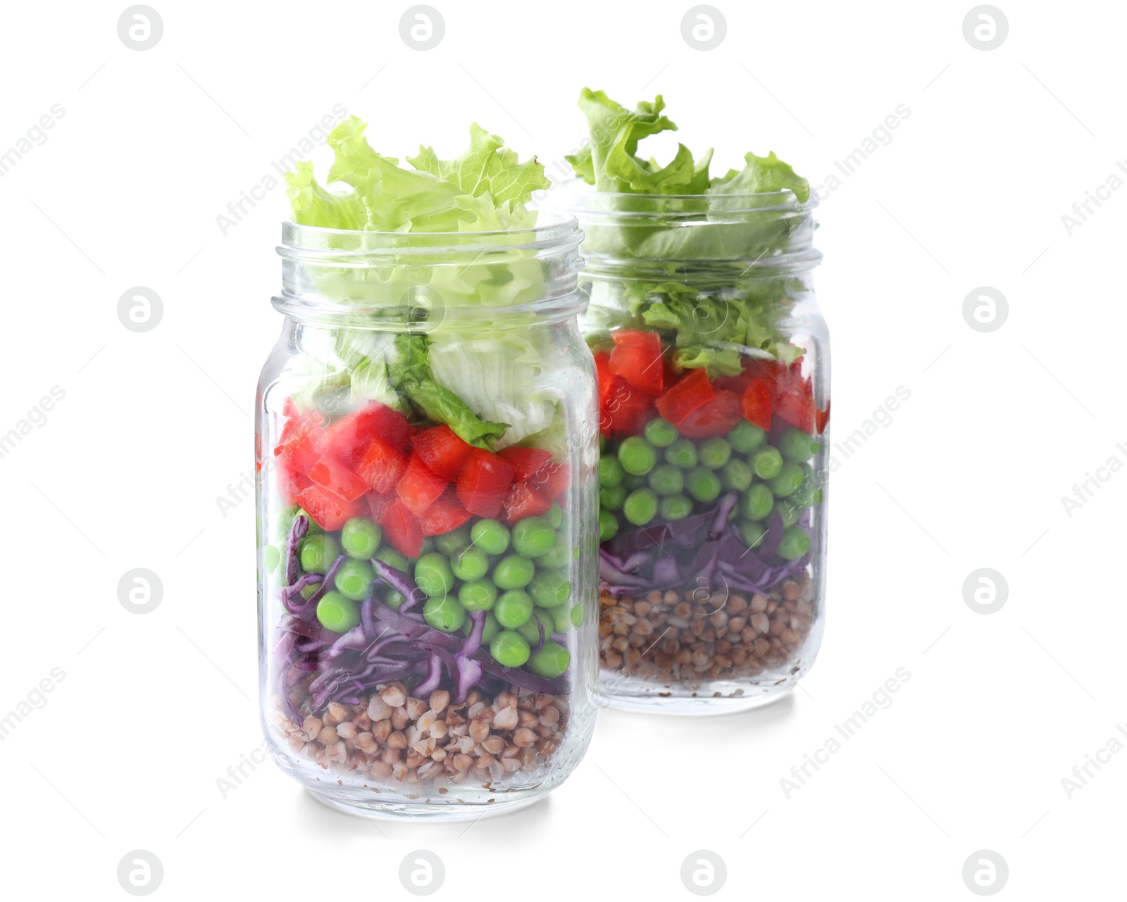 Photo of Healthy salad in glass jars isolated on white