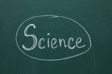Photo of Word Science written with chalk on green board