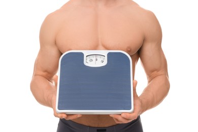 Photo of Athletic man holding scales on white background, closeup. Weight loss concept