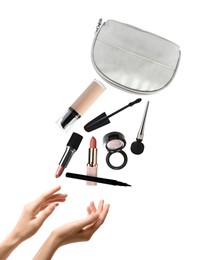 Image of Woman catching makeup products falling from cosmetic bag on white background, closeup