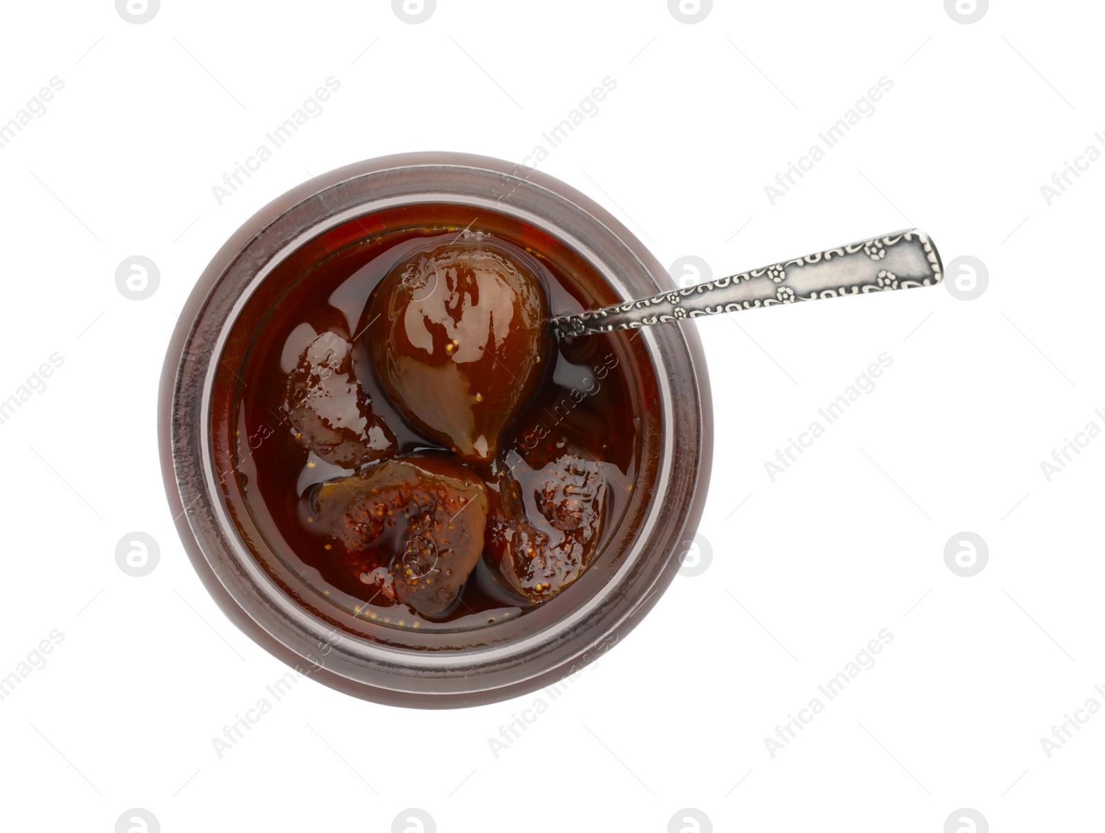 Photo of Jar of tasty sweet fig jam and spoon isolated on white, top view