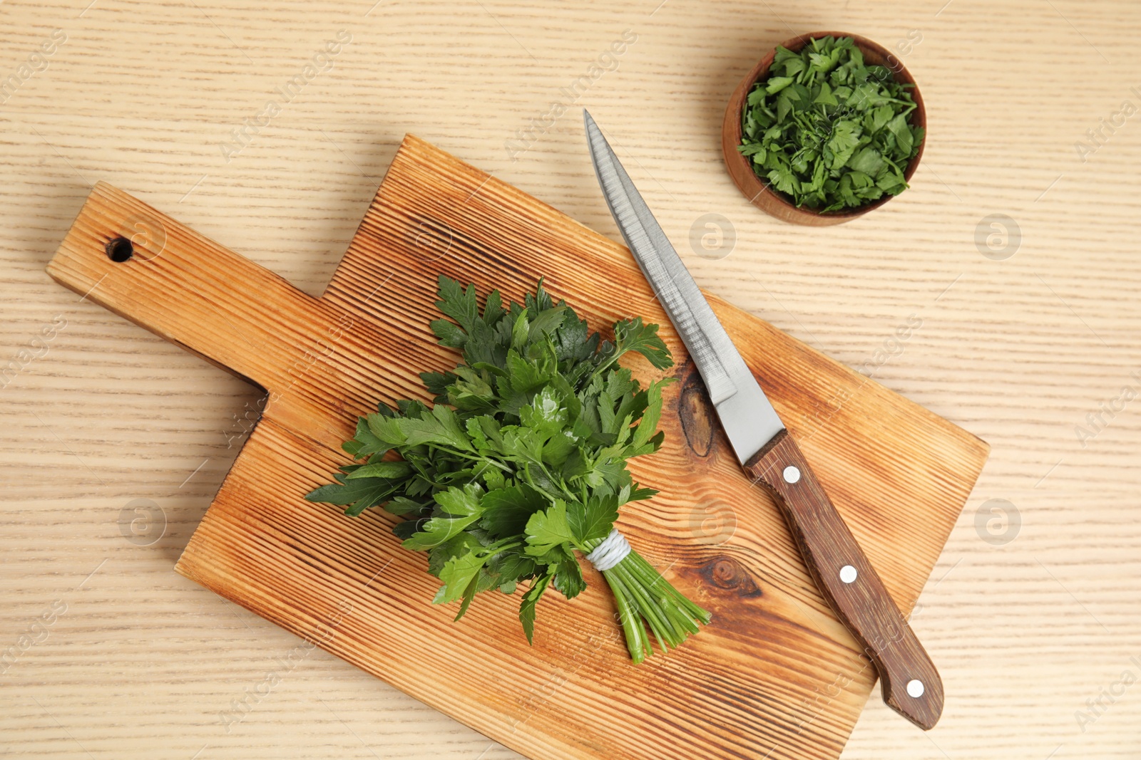 Photo of Flat lay composition with fresh green parsley on wooden background