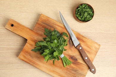 Photo of Flat lay composition with fresh green parsley on wooden background