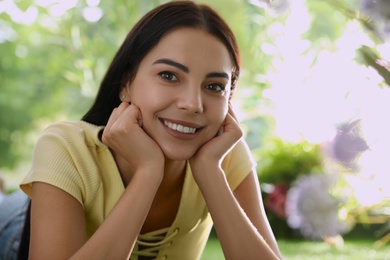 Photo of Beautiful young woman in park on sunny day