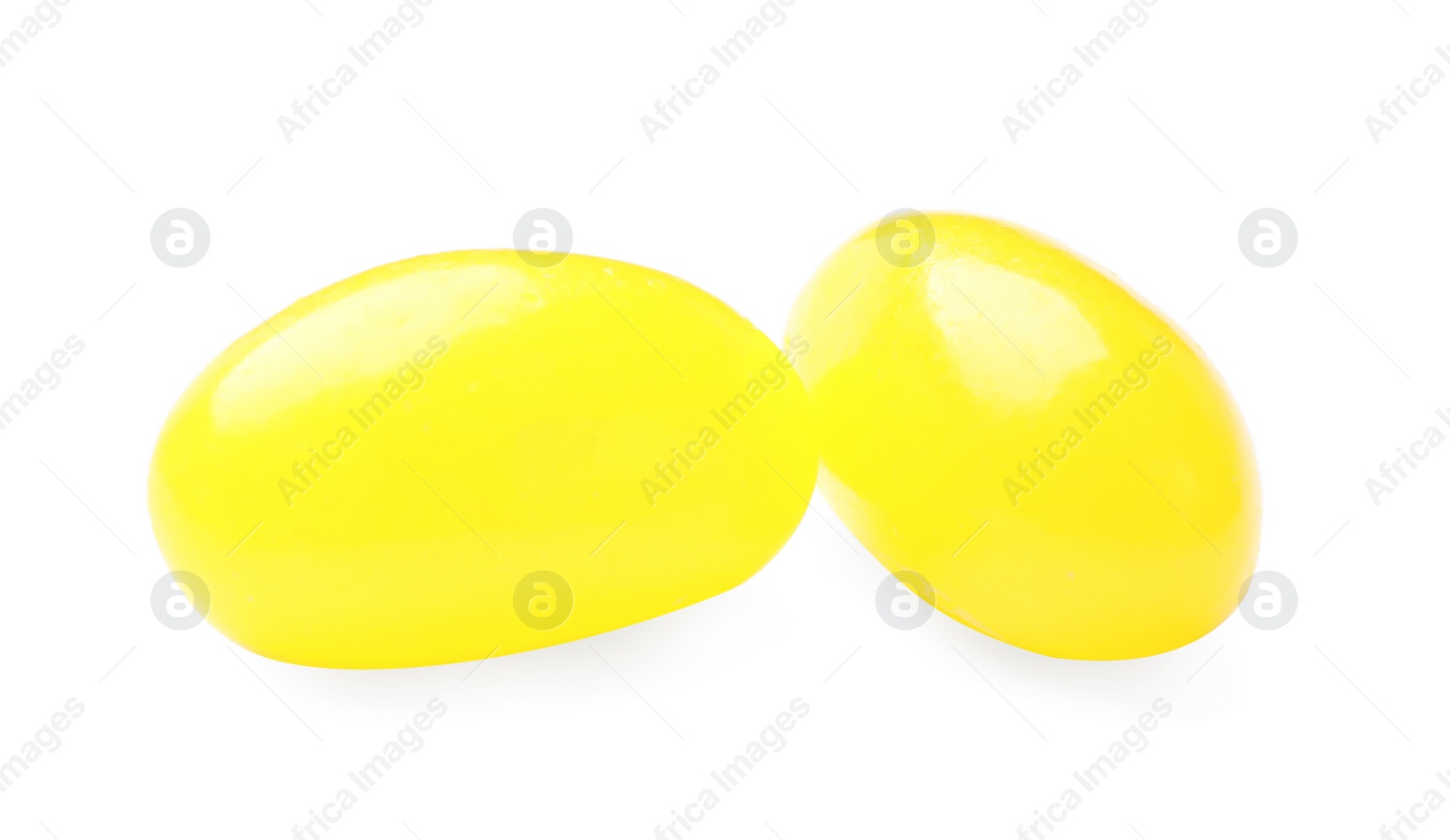 Photo of Tasty small lemon drops isolated on white