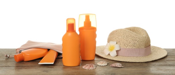 Sun protection products and beach accessories on wooden table