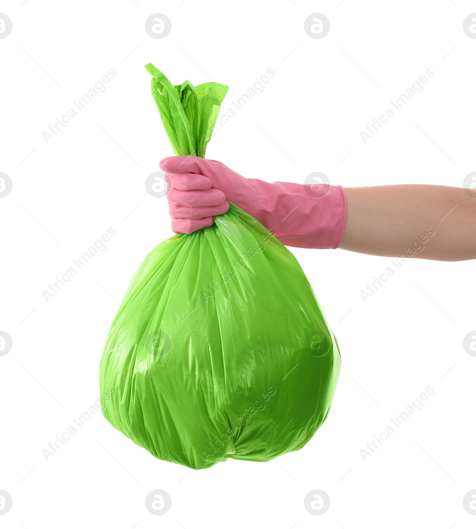 Photo of Woman holding plastic bag full of garbage on white background, closeup