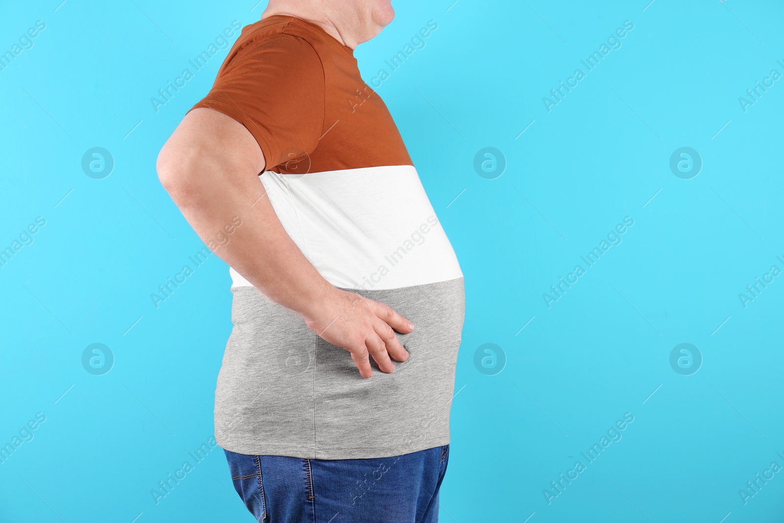Photo of Fat senior man on color background, space for text. Weight loss