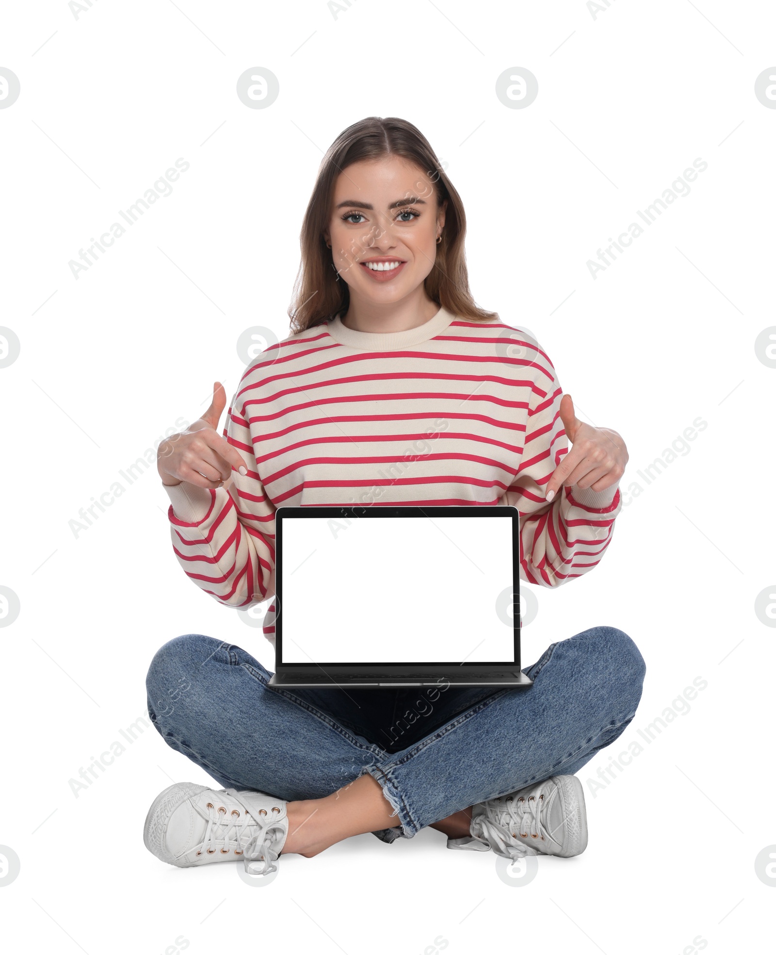 Photo of Happy woman pointing at laptop on white background