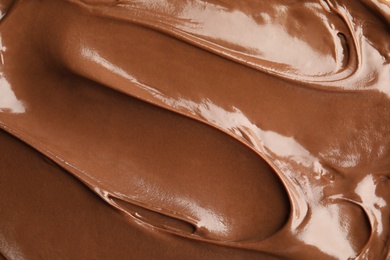 Photo of Sweet tasty chocolate cream as background, closeup