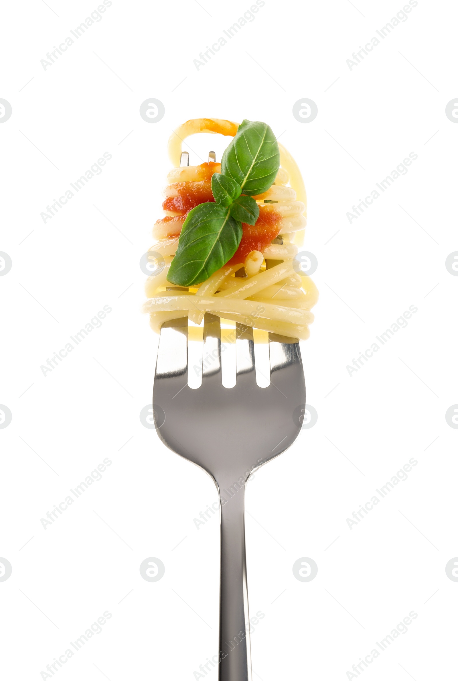 Photo of Fork with tasty pasta, basil and tomato sauce isolated on white