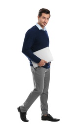 Young male teacher with laptop on white background