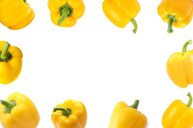 Frame of whole sweet yellow bell peppers on white background