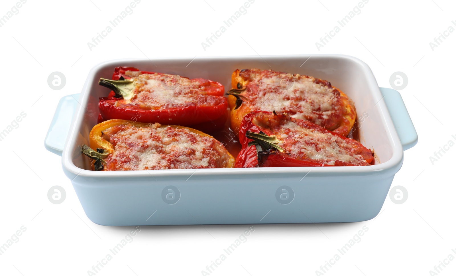 Photo of Tasty stuffed peppers in dish isolated on white