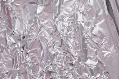 One sheet of crumpled aluminum foil as background, closeup