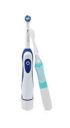 Photo of Electric toothbrushes on white background. Dental care