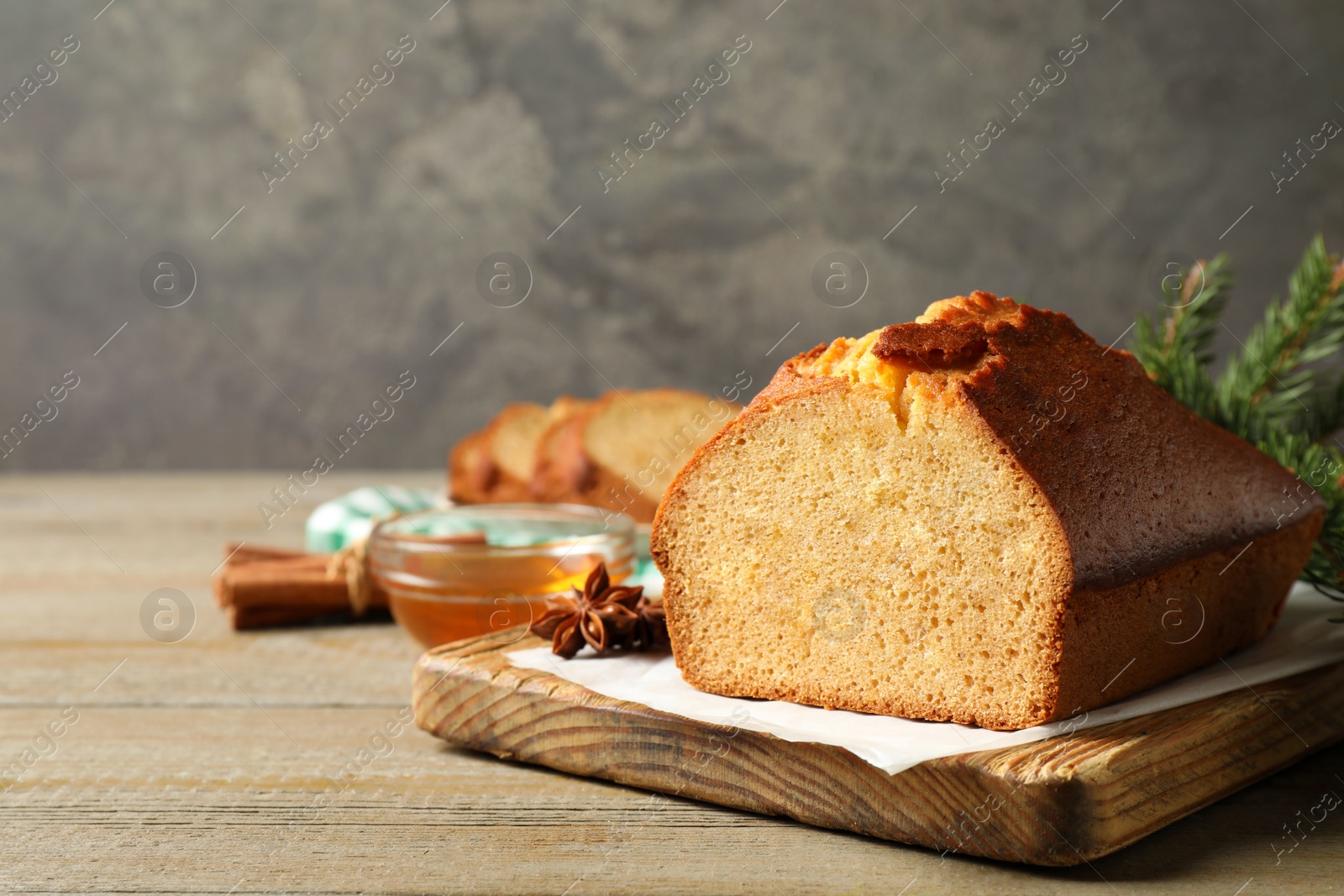 Photo of Delicious gingerbread cake on wooden table. Space for text