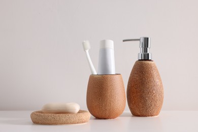 Photo of Different bath accessories and personal care products on white table, space for text