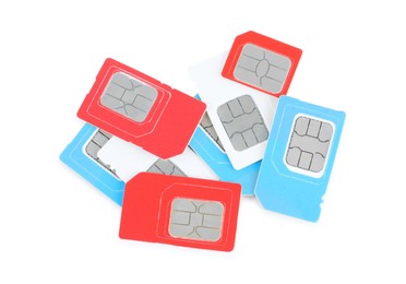 Pile of different SIM cards on white background, top view
