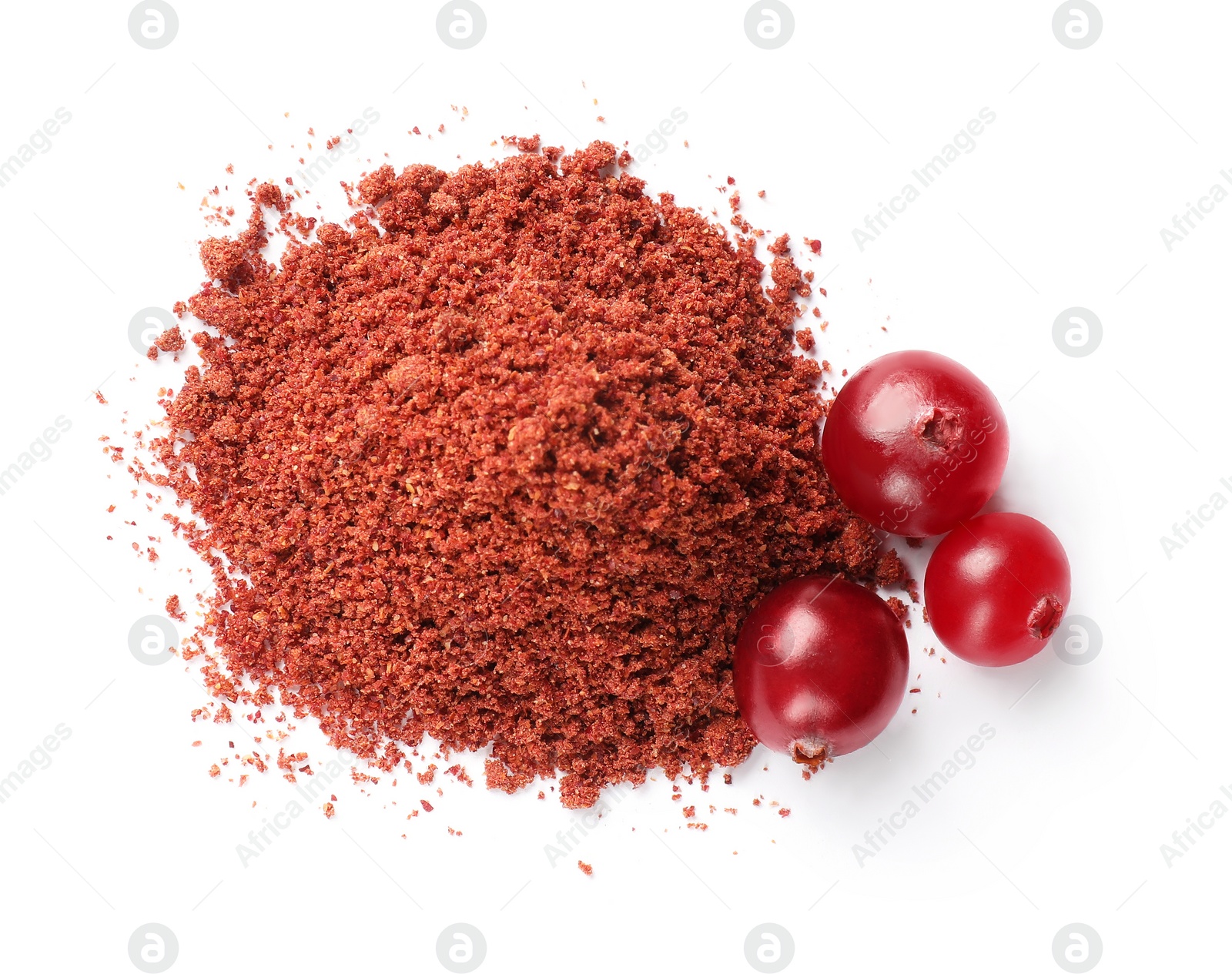 Photo of Dried cranberry powder and berries isolated on white, top view