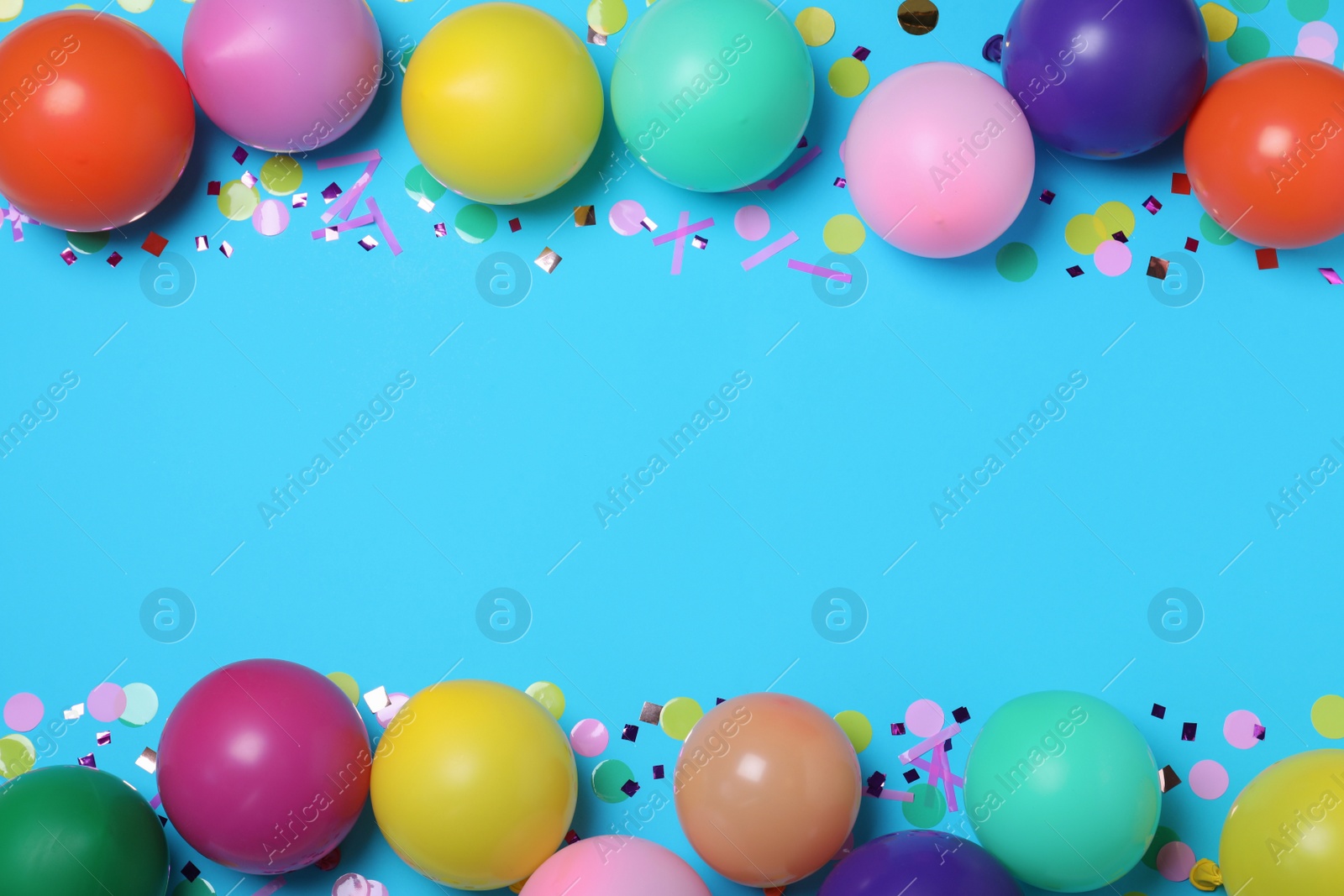 Photo of Many balloons and confetti on light blue background, flat lay with space for text. Birthday decor