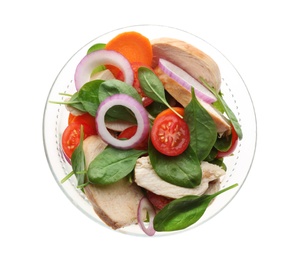 Photo of Delicious salad with chicken, vegetables and spinach in glass bowl on white background, top view