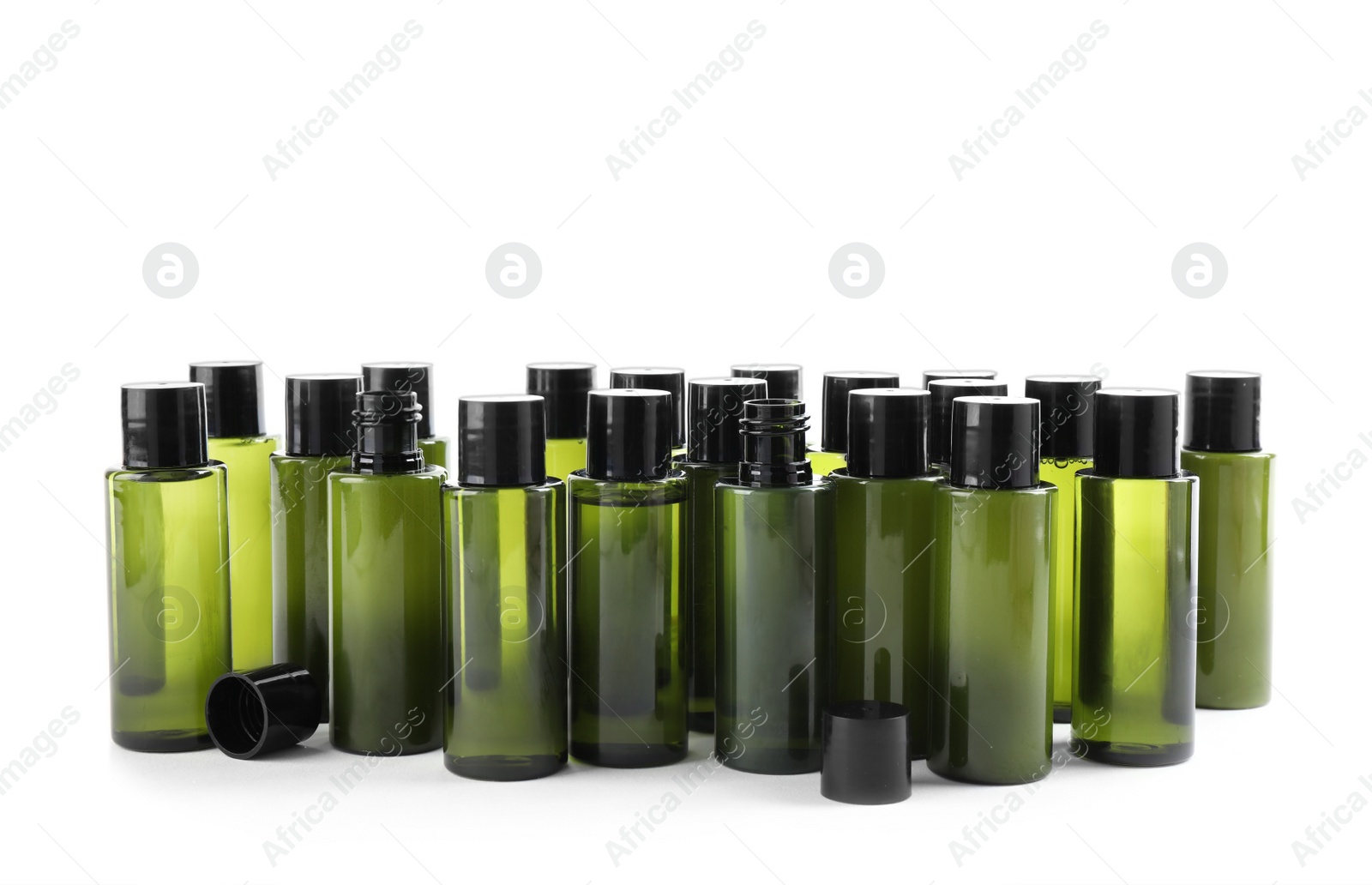 Photo of Mini bottles with cosmetic products on white background