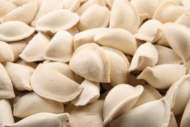 Photo of Raw dumplings as background, closeup. Home cooking